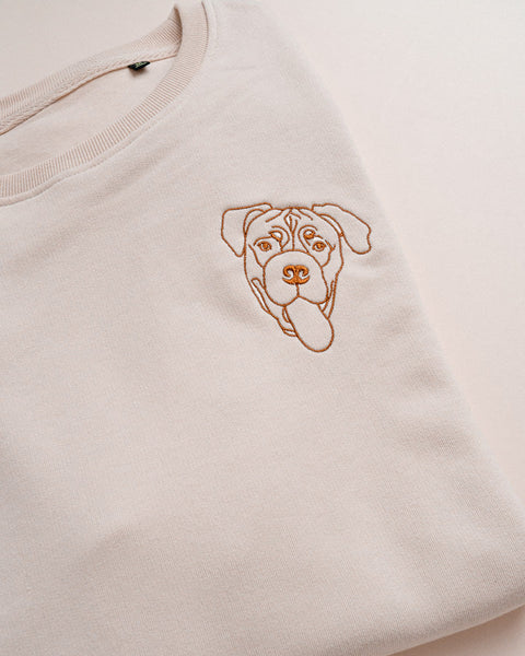 geborduurde sweater met lijntekening van een hond