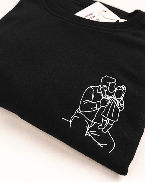 geborduurde sweater met lijntekening van papa en dochter
