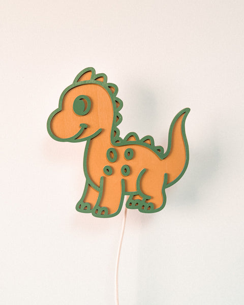 houten wandlamp in de vorm van een dino